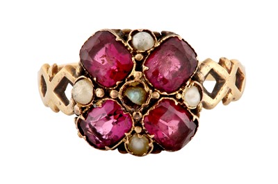 Lot 23 - A GARNET AND SEED PEARL RING