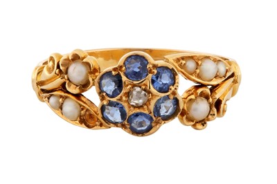 Lot 9 - A SAPPHIRE AND SEED PEARL RING