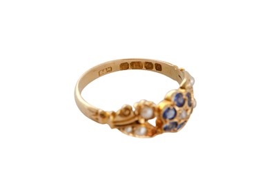 Lot 9 - A SAPPHIRE AND SEED PEARL RING