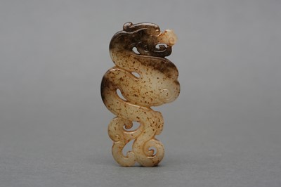 Lot 126 - A CHINESE GREY AND BLACK ARCHAISTIC JADE 'DRAGON' PENDANT