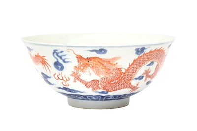 Lot 108 - A CHINESE BLUE AND WHITE AND IRON-RED 'DRAGONS' BOWL