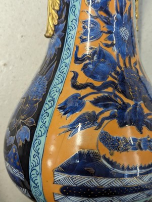 Lot 14 - A CHINESE CLOBBERED BLUE AND WHITE ORMOLU-MOUNTED VASE