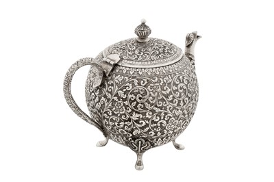 Lot 112 - A late 19th / early 20th century Anglo – Indian unmarked silver three-piece tea service, Cutch circa 1900