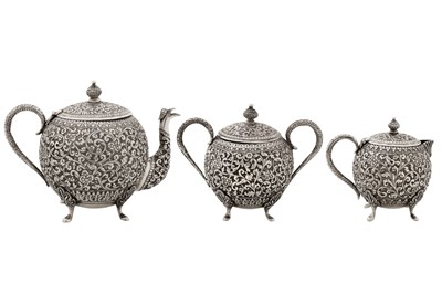 Lot 112 - A late 19th / early 20th century Anglo – Indian unmarked silver three-piece tea service, Cutch circa 1900