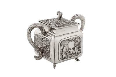 Lot 187 - An early 20th century Chinese export silver three-piece tea service, Canton circa 1920 by Qiao Zhen, retailed by Cum Wo of Hong Kong