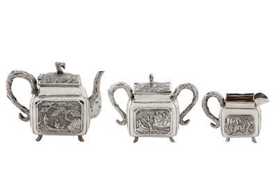 Lot 187 - An early 20th century Chinese export silver three-piece tea service, Canton circa 1920 by Qiao Zhen, retailed by Cum Wo of Hong Kong