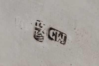 Lot 187 - An early 20th century Chinese export silver three-piece tea service, Canton circa 1920 by Qiao Zhen, retailed by Cum Wo of Hong Kong