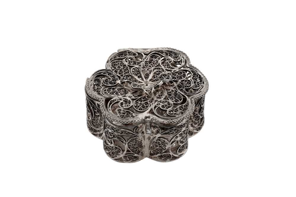 Lot 27 - A late 17th century English unmarked silver filigree scent bottle case