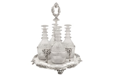 Lot 369 - A Victorian sterling silver four bottle decanter stand, London 1842 by John and Henry Lias