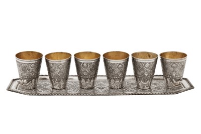 Lot 211 - A set of mid-20th century Persian (Iranian) silver shot cups on tray, Isfahan circa 1970 by Seyyed Hassan Jouzdani (b.1928, d.c. 2022)