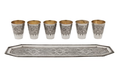 Lot 211 - A set of mid-20th century Persian (Iranian) silver shot cups on tray, Isfahan circa 1970 by Seyyed Hassan Jouzdani (b.1928, d.c. 2022)