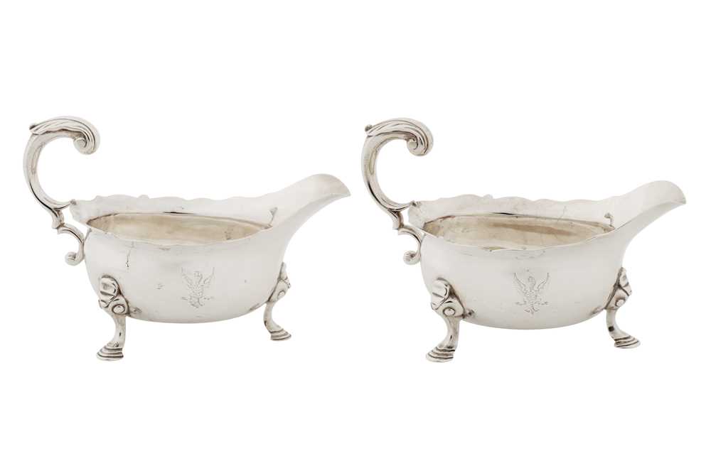 Lot 417 - A pair of George II sterling silver sauce boats, London 1748 by John Pollock
