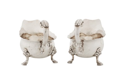 Lot 417 - A pair of George II sterling silver sauce boats, London 1748 by John Pollock