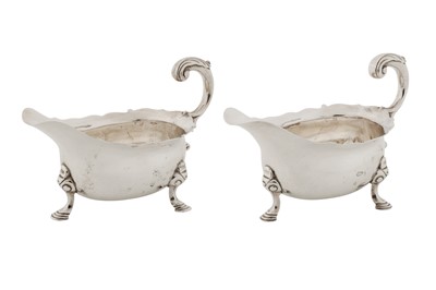 Lot 417 - A pair of George II sterling silver sauce boats, London 1748 by John Pollock