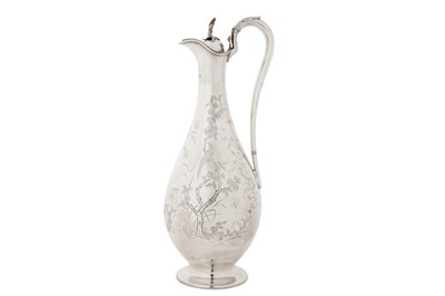 Lot 390 - A Victorian sterling silver ‘aesthetic’ claret jug, London 1880 by Martin, Hall and Co