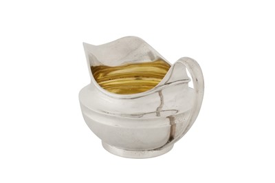 Lot 424 - A George III sterling silver cream jug, London 1819 by Robert Garrard II (reg. 16th April 1818)