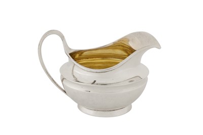 Lot 424 - A George III sterling silver cream jug, London 1819 by Robert Garrard II (reg. 16th April 1818)