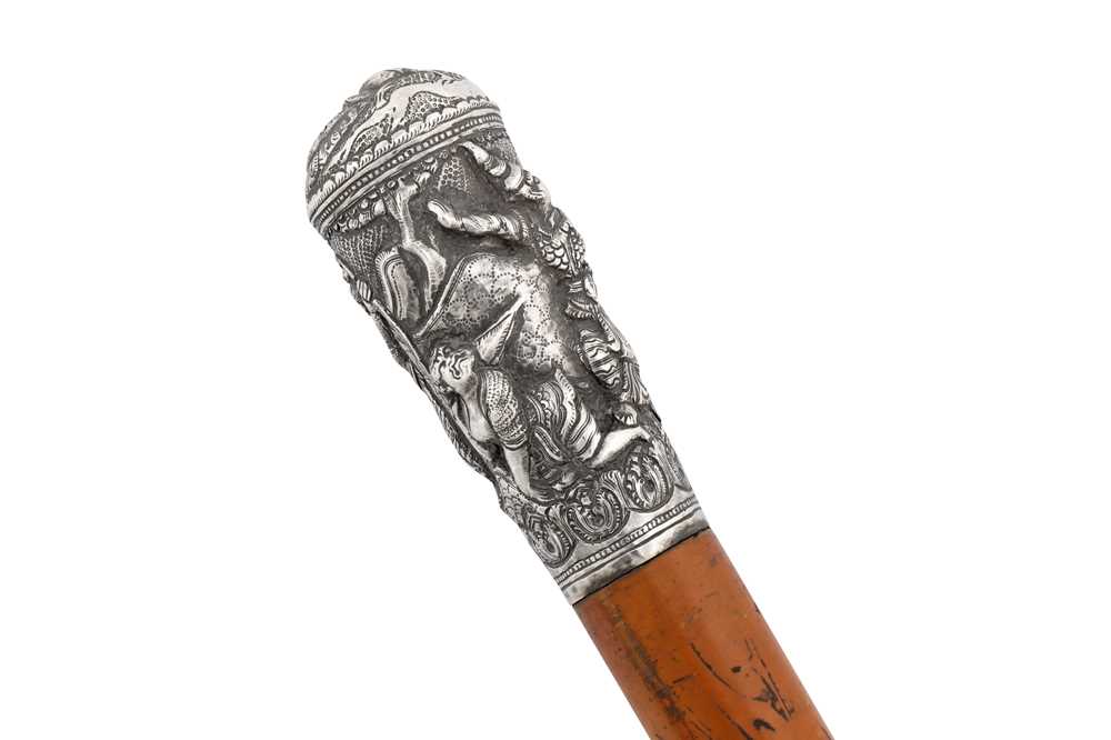 Lot 132 - An early 20th century Burmese unmarked silver walking cane, probably Mandalay circa 1920