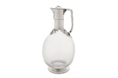 Lot 363 - A Victorian sterling silver mounted glass claret jug, London 1883 by Edward H Stockwell