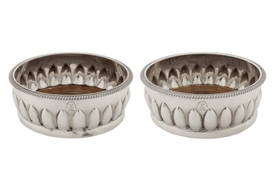 Lot 446 - A pair of George III sterling silver wine coasters, London 1802 by Solomon Hougham