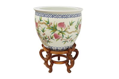 Lot 218 - A CHINESE FAMILLE-ROSE 'PEACHES' JARDINIERE AND WOOD STAND