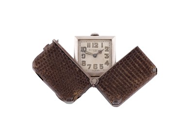 Lot 71 - A SMALL SILVER CARRY WATCH