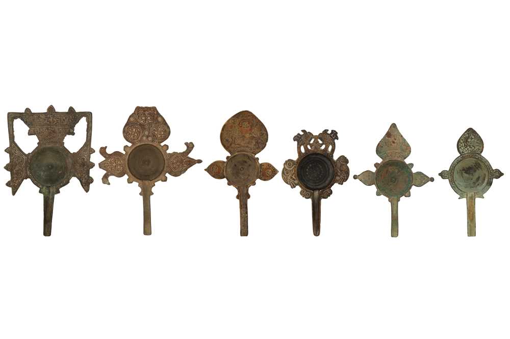 Lot 67 - A COLLECTION OF SIX RARE 11TH-12TH CENTURY PERSIAN SELJUK BRONZE MEDICINAL POURING VESSELS