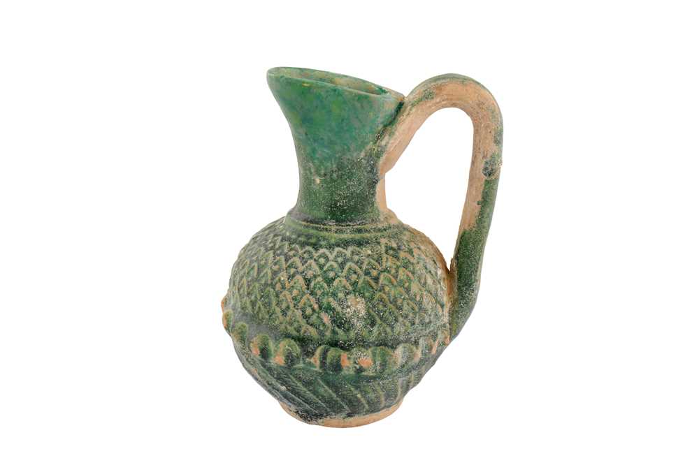 Lot 34 - A RARE 8TH-9TH CENTURY SYRIAN UMAYYAD GREEN GLAZED JUG