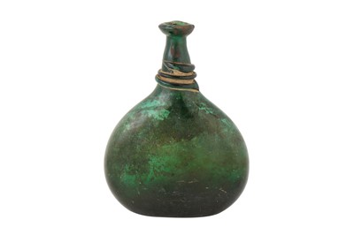 Lot 85 - AN 18TH CENTURY PERSIAN SAFAVID GREEN GLASS SADDLE FLASK