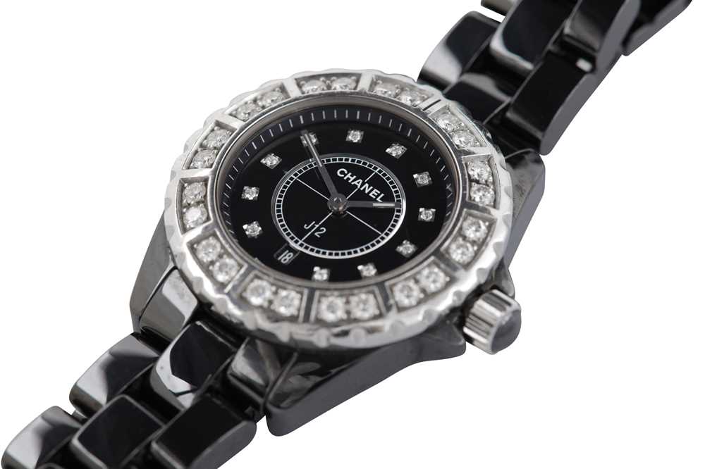 Lot 368 - CHANEL. A BLACK CERAMIC AND DIAMOND J12 WRISTWATCH