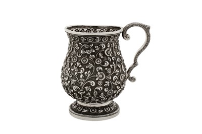 Lot 105 - A mid to late 19th century Anglo - Indian unmarked silver mug, Cutch circa 1870