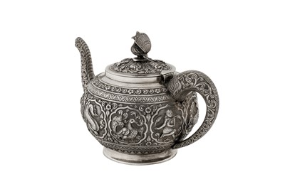 Lot 116 - A late 19th / early 20th century Anglo - Indian unmarked silver teapot, Madras circa 1900