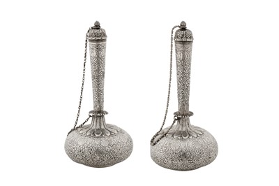 Lot 100 - A pair of late 19th century Anglo – Indian unmarked silver small water bottles (surhai), Lucknow circa 1880