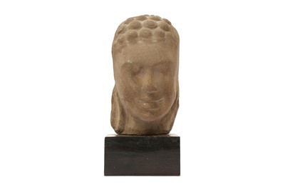 Lot 554 - A KHMER OR THAI SANDSTONE HEAD OF BUDDHA