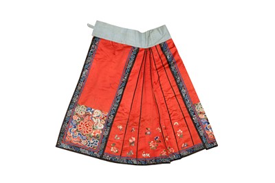 Lot 220 - A CHINESE SILK EMBROIDERED RED-GROUND SKIRT