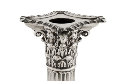 Lot 344 - A pair of Edwardian sterling silver candlesticks, London 1903 by William Hutton and Sons
