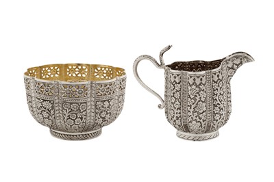 Lot 91 - A late 19th century Anglo - Indian unmarked silver milk jug and sugar bowl, Kashmir circa 1890