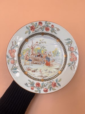 Lot 38 - A CHINESE EXPORT FAMILLE ROSE 'CARD PLAYERS' DISH AFTER DAVID TENIERS
