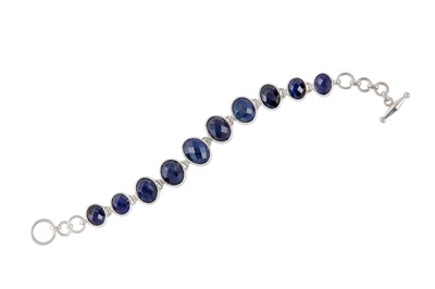 Lot 214 - A SAPPHIRE AND SILVER BRACELET