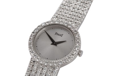 Lot 342 - PIAGET - A FINE DIAMOND-SET BRACELET WATCH