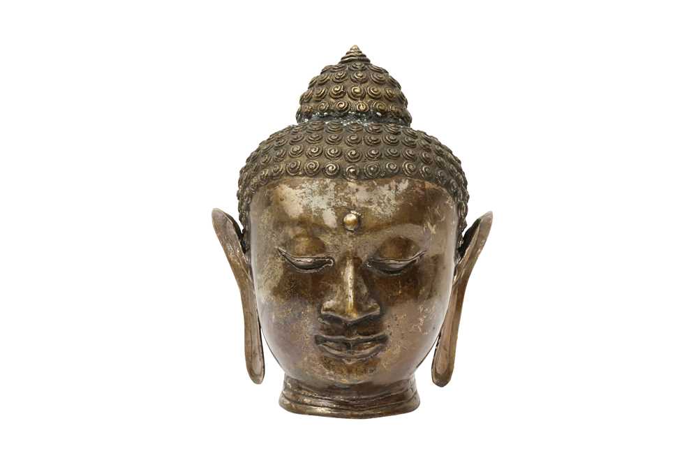 Lot 545 - A THAI METAL ALLOY HEAD OF BUDDHA
