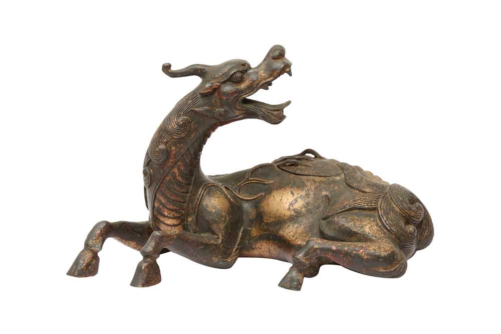 Lot 169 - A CHINESE GILT-BRONZE 'QILIN' CENSER