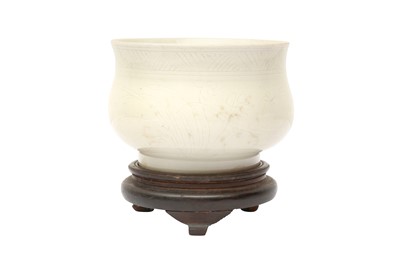 Lot 260 - A CHINESE DING-STYLE WHITE-GLAZED BOMBE CENSER