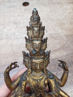 Lot 181 - A SINO-TIBETAN GILT-BRONZE FIGURE OF ELEVEN-HEADED EKADASAMUKHA AVALOKITESHVARA