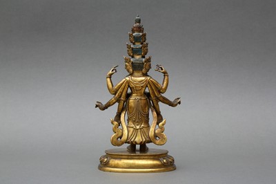 Lot 181 - A SINO-TIBETAN GILT-BRONZE FIGURE OF ELEVEN-HEADED EKADASAMUKHA AVALOKITESHVARA