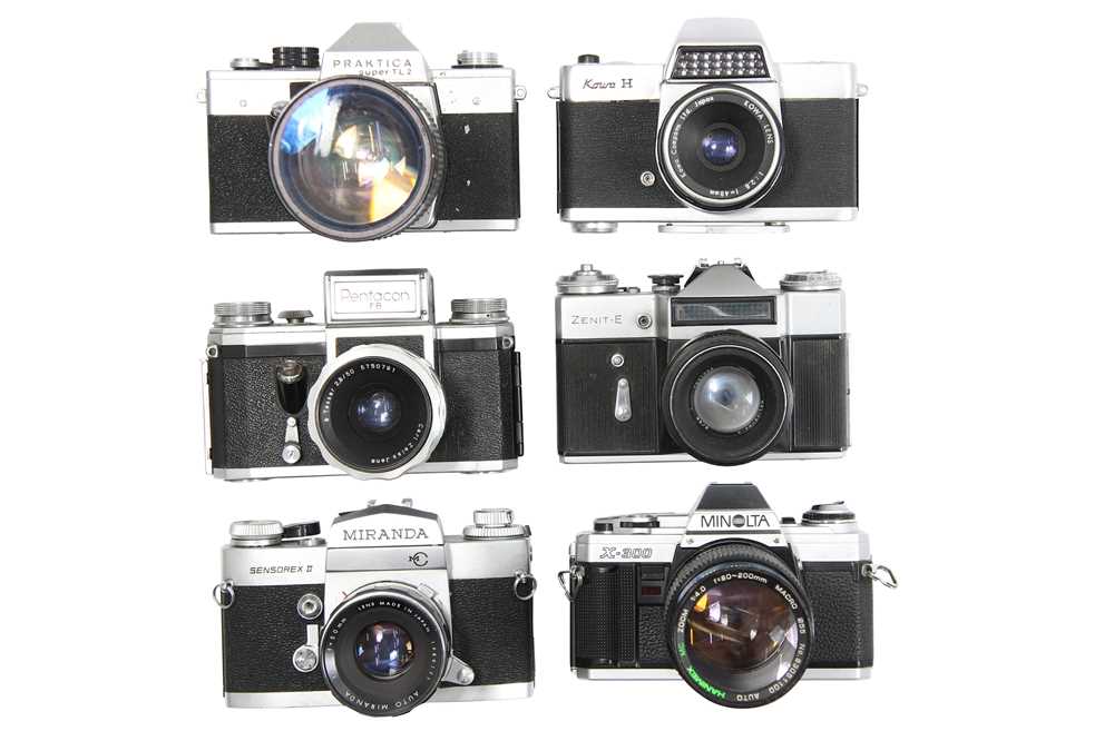 Lot 114 - Six Mechanical 35mm SLR Cameras with Lenses.