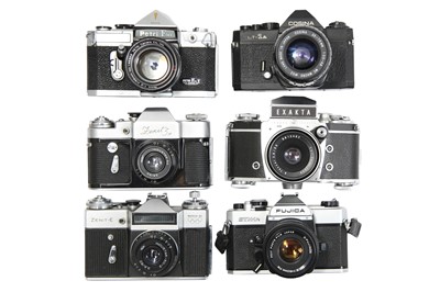 Lot 93 - Six Mechanical 35mm SLR Cameras With Lenses.
