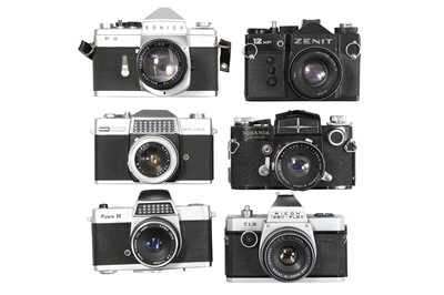 Lot 113 - Six Mechanical 35mm SLR Cameras With Lenses.