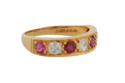 Lot 21 - A RUBY AND DIAMOND SEVEN-STONE RING, CIRCA 1982