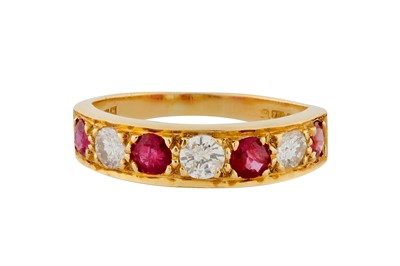 Lot 21 - A RUBY AND DIAMOND SEVEN-STONE RING, CIRCA 1982